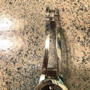 Ladies Movado silver bangle watch with black face